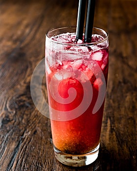 Alabama Slammer Cocktail with black straw.