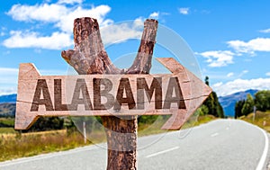 Alabama wooden sign with road background