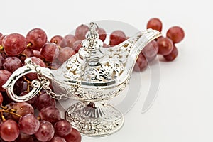 Aladdin's magic lamp and red grapes