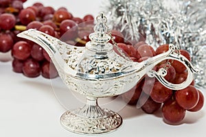 Aladdin's magic lamp and red grapes