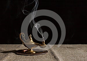 Aladdin`s magic lamp smokes