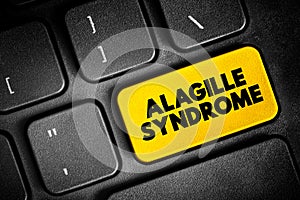Alagille Syndrome is a genetic disorder that can affect the liver, heart, and other parts of the body, text button on keyboard,