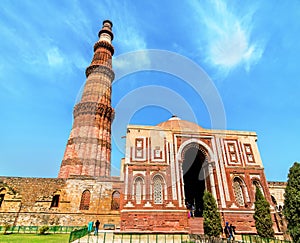 Alai Darwaza and Qutub Minar at the Qutb Complex in Delhi, India photo