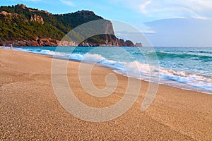 Alanya Castle Alanya Kalesi on the top of peninsula. View on sea from sandy Cleopatra Beach, Alanya.