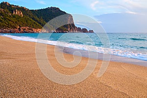 Alanya Castle Alanya Kalesi on the top of peninsula. View on sea from sandy Cleopatra Beach, Alanya.