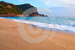 Alanya Castle Alanya Kalesi on the top of peninsula. View on sea from sandy Cleopatra Beach, Alanya.