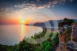 Alanya Castle with the defensive walls of at sunset. Turkey