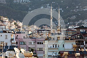 The Alanya cityscape with minarets of mosque and residential houses in center of city. Turkey