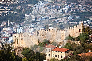 Alanya fortress on a rocky peninsula. View of the fortifications and the city of Alanya. Turkey