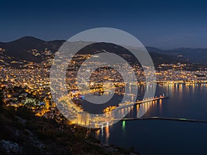 Alanya, Turkey. Beautiful night panoramic top view of the city Alanya, the Mediterranean Sea, the red tower, the lighthouse