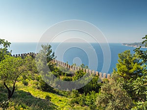 Alanya, Turkey. Beautiful view from the fortress Alanya Castle of the Mediterranean Sea and Cleopatra beach at sunset