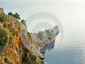 Alanya, Turkey. Beautiful view from the fortress Alanya Castle of the Mediterranean Sea and cliffs at sunset. Vacation postcard