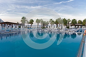Alanya, Turkey - October 05, 2018. Beautiful pool in Kirman Sidera Luxury hotel with clear blue water on background of sea, blue
