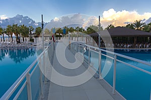 Alanya, Turkey - October 05, 2018. Beautiful pool in Kirman Sidera Luxury hotel with clear blue water on background of sea, blue