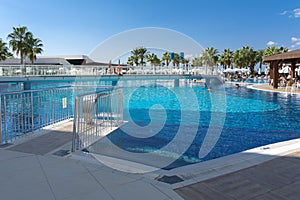 Alanya, Turkey - October 05, 2018. Beautiful pool in Kirman Sidera Luxury hotel with clear blue water on background of sea, blue