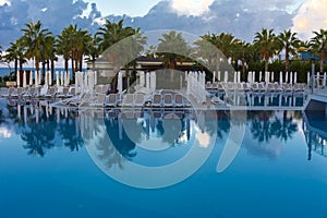 Alanya, Turkey - October 05, 2018. Beautiful pool in Kirman Sidera Luxury hotel with clear blue water on background of sea, blue