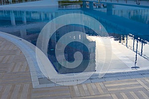 Alanya, Turkey - October 05, 2018. Beautiful pool in Kirman Sidera Luxury hotel with clear blue water on background of sea, blue photo