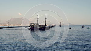 Alanya, Turkey: Pirate ships for tourist trips in the port harbor located in Antalya against mountain. Beautiful sea view and ship