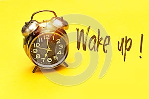 Alarm 7 o` Clock and wake up concept on yellow background