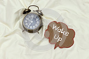 Alarm 7 o` Clock on white sheet bed with wake chat bubblewinter,event,greeting,birthday,package,surprise,celebration,gift,morning