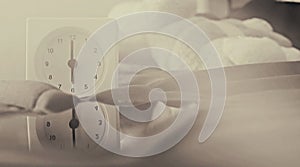 Alarm clock 6 o` clock in the morning on the bed at home. Morning time background concept.