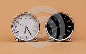 Alarm clock. Beautiful modern clock lies on paper background. time clock time standstill time off work working with time time