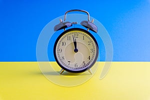 Alarm Clock on colorful background with selective focus