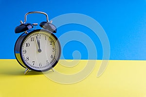 Alarm Clock on colorful background with selective focus