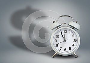 Alarm clock with dollar shadow, time is money concept