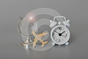 Alarm clock, flight and flare. World travel globe concept isolated