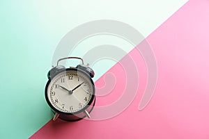 alarm clock gainst color background photo