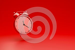 Alarm clock isolated on red background. 3D render. Side view