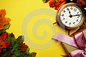 Alarm clock with Maple leaf boder on Yellow background