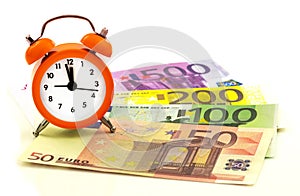 Alarm clock with paper euro money 50, 100, 200, 500