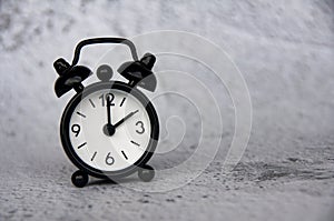 Alarm clock pointing at 2 o'clock with customizable space for ideas or text. Copy space.