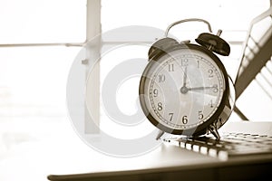 Alarm clock with Radar background on computer, businessman using