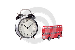 Alarm clock with red toy double decker bus