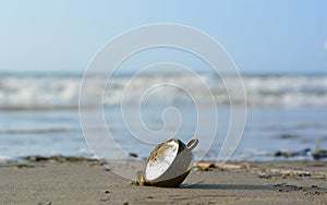 An alarm clock on the sandy beach reminds us that the time of summer photo