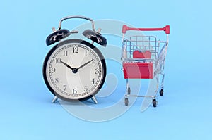 Alarm clock with shopping cart