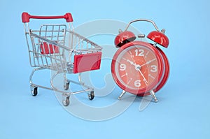 Alarm clock with shopping cart