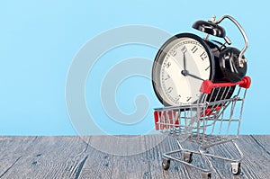 Alarm clock with shopping cart
