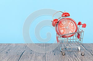 Alarm clock with shopping cart