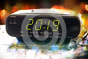 Alarm clock is showing midnight. It is twenty nineteen , christmas and bokeh, holiday happy new year