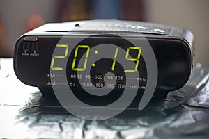 Alarm clock is showing midnight. It is twenty nineteen , christmas and bokeh, holiday happy new year