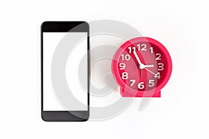 Alarm clock and smart phone on white background.