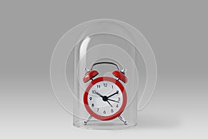 Alarm clock under glass bell - Concept of saving time