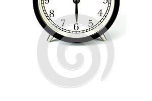 Alarm Clock on white, showing six o`clock