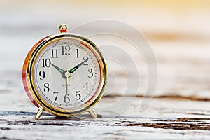 Alarm clock on wooden table