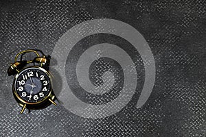 Alarm showing 7 o` Clock on grunge leather  background