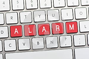 ALARM writing on white keyboard